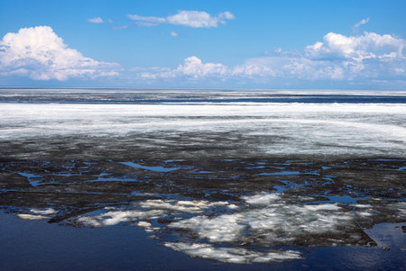 Quebec, Roberval, an area still frozen of the St Jean lakeの写真素材