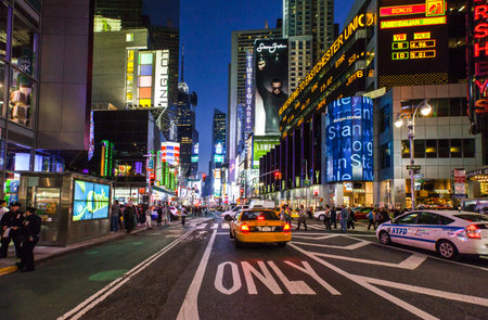 New York, U.S.A. - October 9, 2010:  Manhattan, people and neon sign  in Times Square areaのeditorial素材