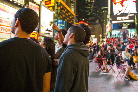 New York, U.S.A. - October 9, 2010:  Manhattan, people and neon sign  in Times Square areaのeditorial素材
