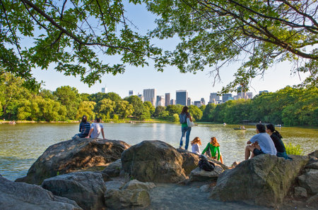 New York, U.S.A. - July 11, 2009: Manhattan, young people in Central Park lakeのeditorial素材