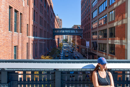 New York, U.S.A. - October 9, 2010: Manhattan, a girl taking a sunbath on the High Lineのeditorial素材