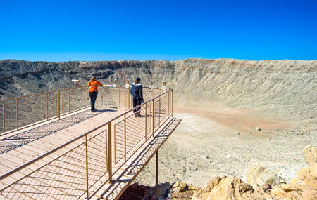 Meteor City, U.S.A.  - May 24, 2011: Arizona, people in the meteor crater near the Route 66のeditorial素材