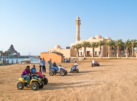 Jeddah, Saudi Arabia - November 19, 2008: Local young people people on the Corniche at the sunset.のeditorial素材