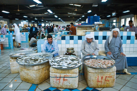 Manama, Bahrain - December 11, 2006: Local fish vendors in the Central Market.のeditorial素材