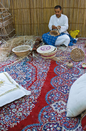 Al Jasra,  Bahrain - December 11, 2006:  Artisans at work in the Traditional Craft Center.のeditorial素材