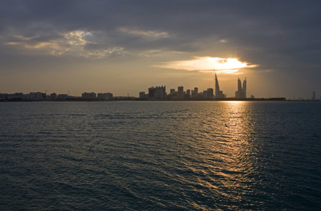 Bahrain, Manama, the city at sunset seen from the La Shaikh  Isa Causewayの写真素材