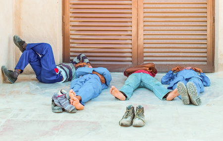 Dubai, U.A.E. - February 13,  2007:  Workers in a moment of relax  in the Bastakija quarterのeditorial素材