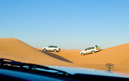 Dubai, U.A.E. - February 15,  2007:  Off the road cars in the Al Dhana desertic areaのeditorial素材