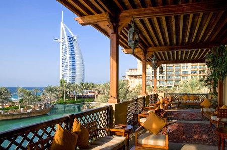 Dubai, U.A.E. - November 12, 2006:  An open air bar restaurant of the Madinat Jumeirah resort, in the background the Burj al Arab towerのeditorial素材