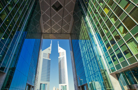 Dubai, U.A.E. - February 18,  2007: The architectures of the business area of the  Sheik Zaied Road. The Emirates Towers in the backgroundのeditorial素材