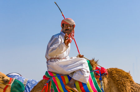 Dubai, U.A.E. - February 18,  2007: A camel racing trainer in the outskirts of the cityのeditorial素材