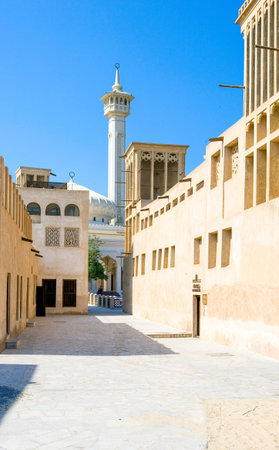 Dubai, U.A.E. - November 11, 2006:  Wind towers and mosque in the old Bastakija quarterのeditorial素材