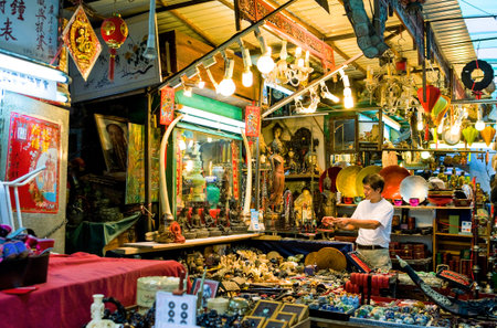 Hong Kong, China - September 23,  2007: A young seller in the flea market near Hollywood road.のeditorial素材