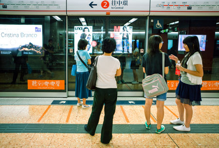 Hong Kong, China - September 25,  2007: Young people in a metro station.