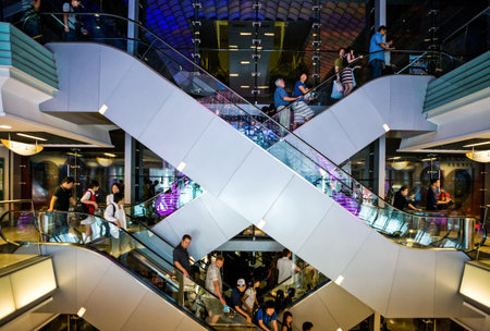 Hong Kong, China - September 22,  2007: People on the escalators of the Peack Tower resort and shops