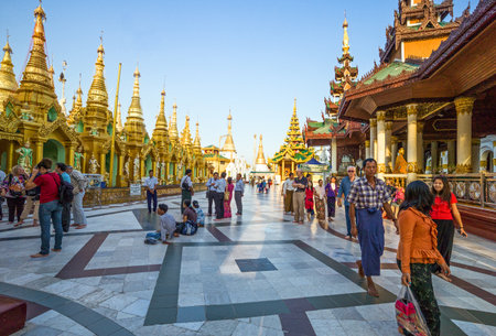 Yangon,  Myanmar - January 9, 2012:  Local  people in the Swedagon Pagoda.のeditorial素材