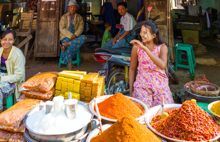 Yangon,  Myanmar - January 10, 2012:  Local vendors in the Hleku street market, along the road from Yangon to Bago.のeditorial素材