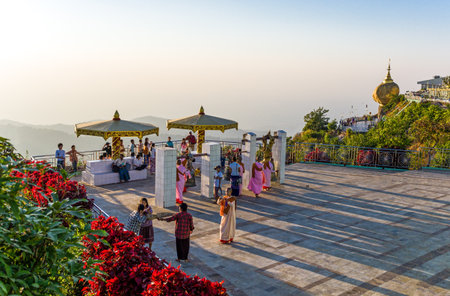 Kyaikhto,  Myanmar - January 10, 2012:  People and monks on a terrace of the sacred Buddhist mountain of Kyaikhtoのeditorial素材