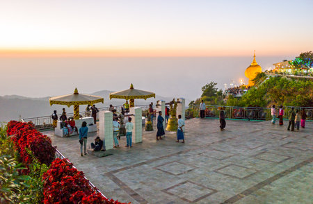 Kyaikhto,  Myanmar - January 10, 2012: Local people on  a terrace of the sacred Buddhist mountainのeditorial素材