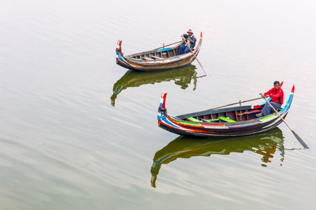 Mandalay,  Myanmar - January  13, 2012: Fishermen on the Tuang lake.のeditorial素材