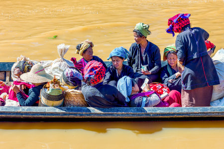 Inla Lake.  Myanmar, - January 14, 2012: Shan State, local women on a water transport boatのeditorial素材