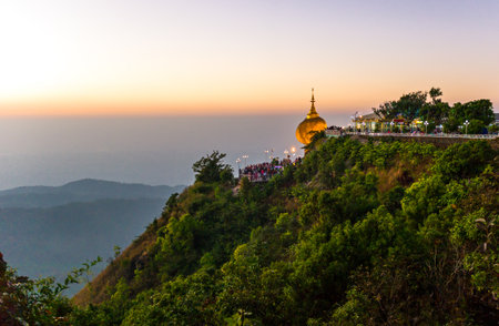Myanmar, panoramic view of the delicately balanced golden Stupa on the sacred Buddhist mountain of Kyaikhtoのeditorial素材