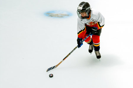 Doha,  Qatar - April 7, 2006: An  ice skating young player in an elegant shopping center of the cityのeditorial素材