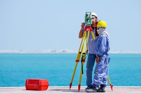 Doha,  Qatar - April 10, 2006:  Workers in a costruction site of the business areaのeditorial素材