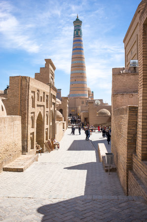 Khiva, Uzbekistan - Aprilr 14, 2014:  The Islam Kodija minaret in the old city centerのeditorial素材