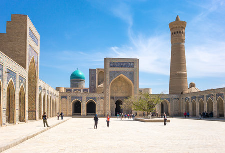 Buckara, Uzbekistan - Aprilr 16, 2014: Local people and tourists  in the inside square of the Kalon mosqueのeditorial素材