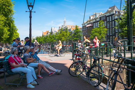 Amsterdam, Holland - July 22, 2014: Red Light district. local people and tourists relaxing near a traditional drawbridgeのeditorial素材