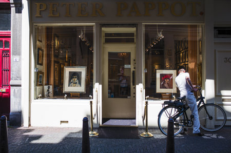 Amsterdam, Holland - July 23, 2014:  People and art shops in Spiegelkwartier