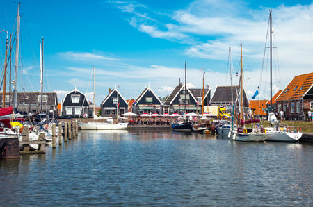Marken, Holland - July 24, 2014: Waterland district, boats in the little harbour of the villageのeditorial素材