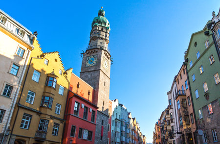 Innsbruck, Austria - February 8, 2010: The Town Hall tower over the traditional houses at sunsetのeditorial素材