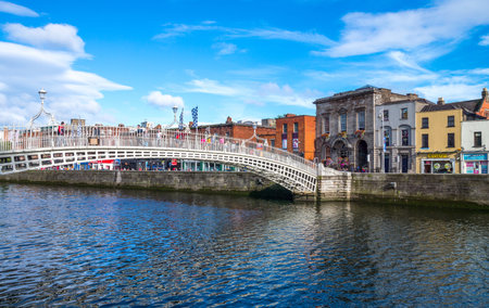 Dublin,  Ireland - July 31, 2013:  The Ha'penny bridge on the Liffey river, Temple Bar districtのeditorial素材