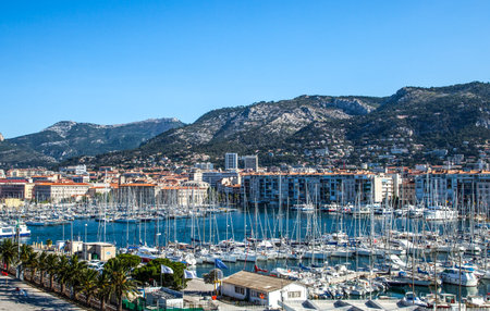 Toulon, France - June 26, 2009: The harbor crowded of boats with the city in the background.のeditorial素材