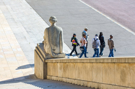 Paris,  France - August 30, 2011:  Tourists between the statue of the TrocadÃ©ro Esplanade...