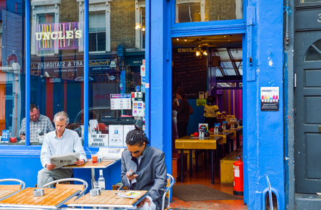 London, England - June 29, 2008:  People in a bar of Portobello streetのeditorial素材