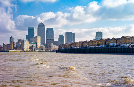 London, England - February 1, 2012: The Canary Wharf financial district seen from the Thames riverのeditorial素材