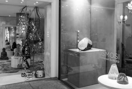 Milan, Italy - July 5, 2014: A woman in a shopwindow of  Montenapoleone street