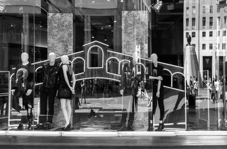 Milan, Italy - July 5, 2014: Reflections on a shopwindow in San Babila squareのeditorial素材
