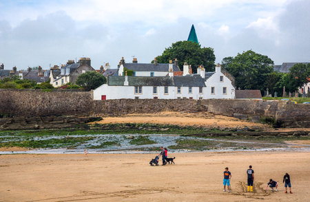 Anstruther, Scotland - July 26, 2012:  Fife area, people on the beach of the fishermen village.のeditorial素材