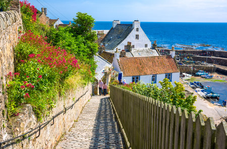 Crail, Scotland - July 26, 2012:  Fife area, people between  traditional houses on the harbor.のeditorial素材