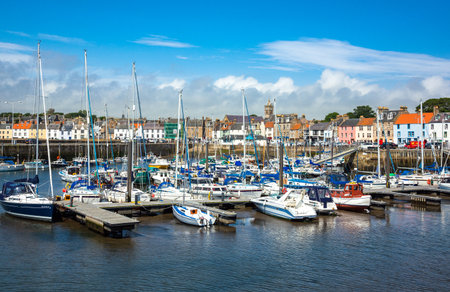 Anstruther, Scotland - July 26, 2012:  Fife area,  yachts in the village harbor at low tide.のeditorial素材