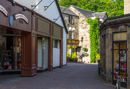 Pitlochry, Scotland - July 25, 2012: Highlands, stores in an alley of the village.のeditorial素材