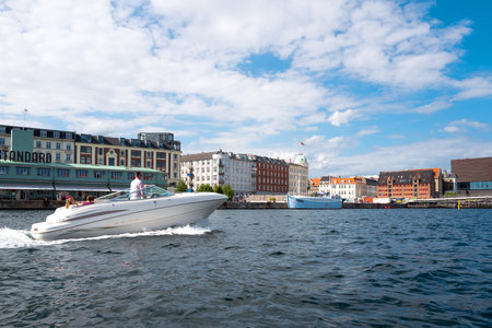 Copenhagen, Denmark - July 22, 2015: Panorama of the city seen from the main canal with a speedboatのeditorial素材