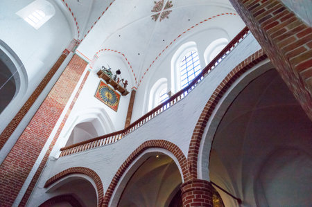 Roskilde, Denmark - July 23, 2015:  Upward view of the St.George and dragon clock in the medieval Cathedralのeditorial素材