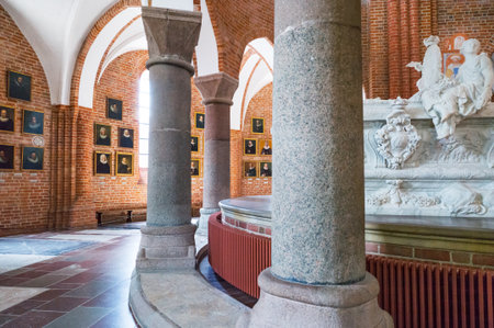 Roskilde, Denmark - July 23, 2015: The chancel with the Royal tombs and the ancient priest portraits in the medieval Cathedralのeditorial素材