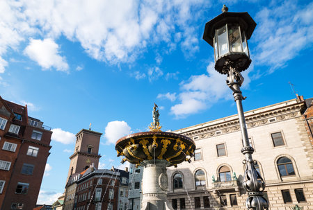 Copenhagen, upward view of the fountain of Nytorv squareの写真素材