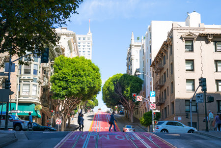 San Francisco, USA - September 24, 2015: People crossing the cable car tracks in Mason street